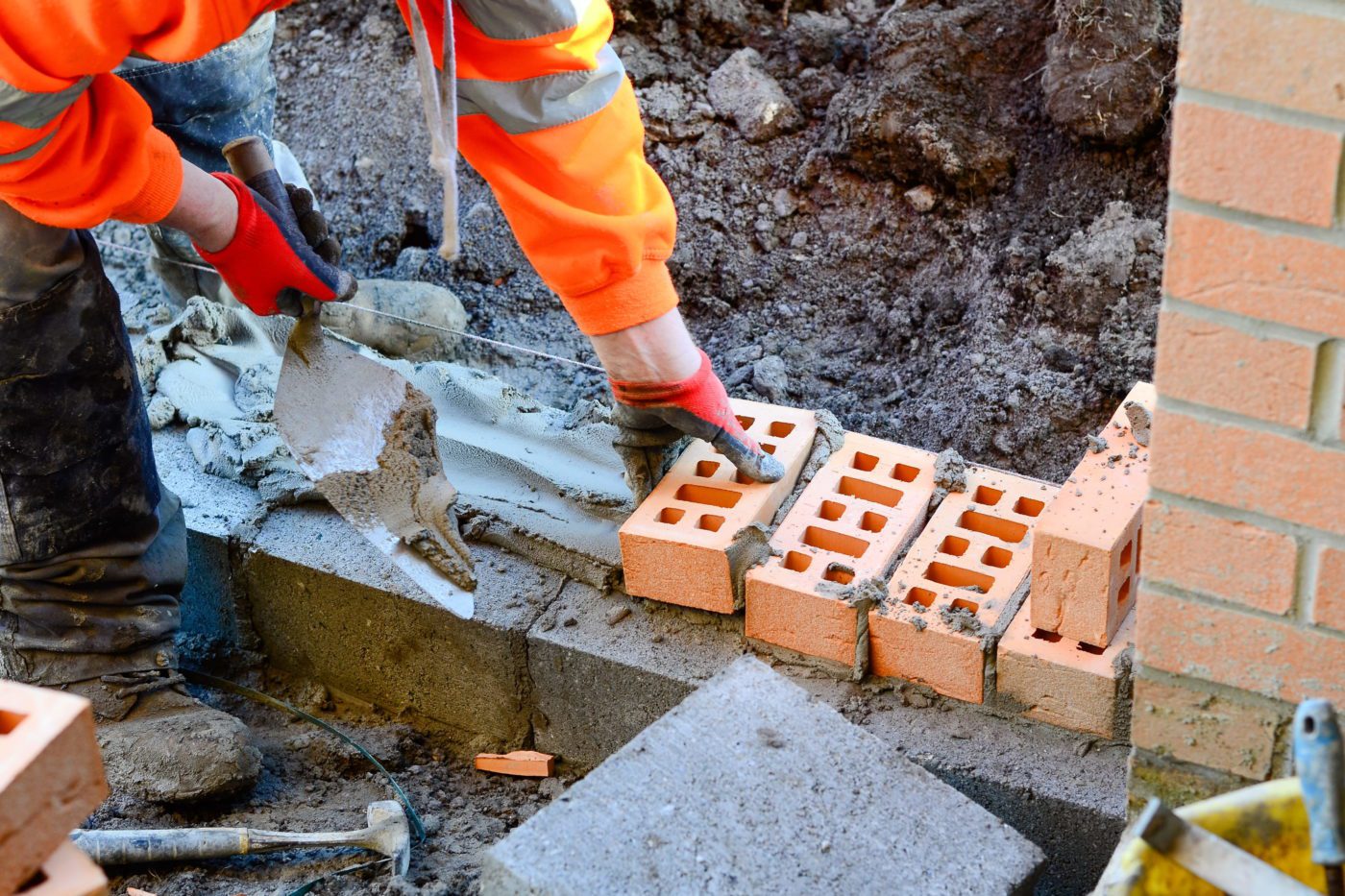 A man laying bricks